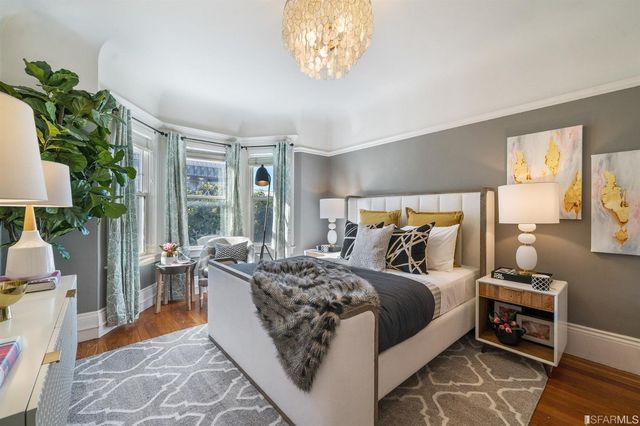 a bedroom with bed and a window