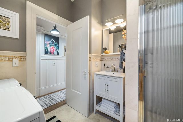 a bathroom with a sink a vanity and a mirror