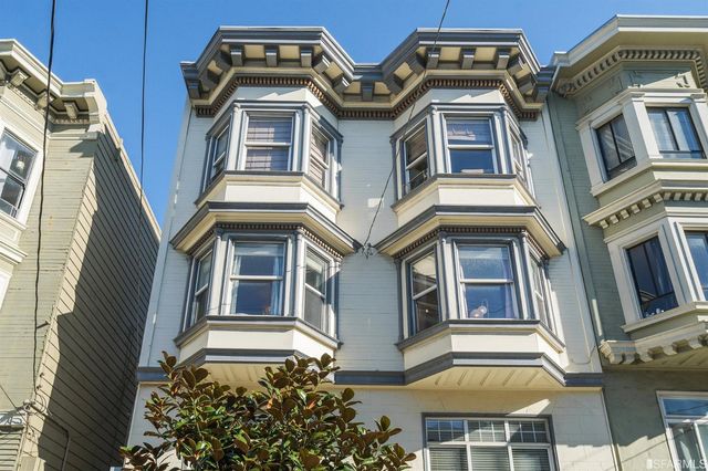 a front view of a multi story residential apartment building