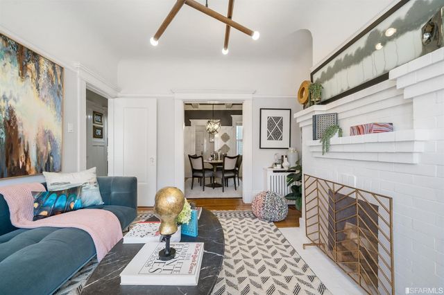 a bedroom with furniture and a fireplace