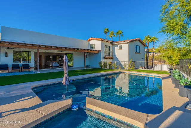 a view of an house with backyard porch and sitting area