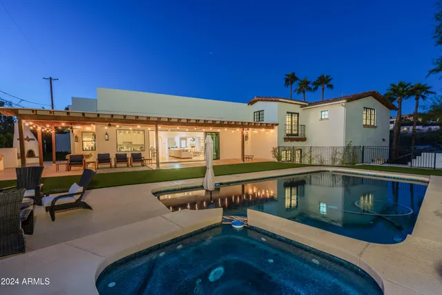 a view of a room with furniture wooden floor and windows