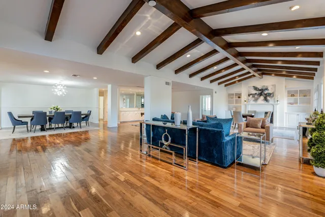 a kitchen with granite countertop a sink stove and cabinets