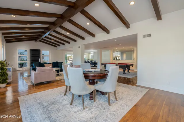 a kitchen with stainless steel appliances a sink stove and cabinets