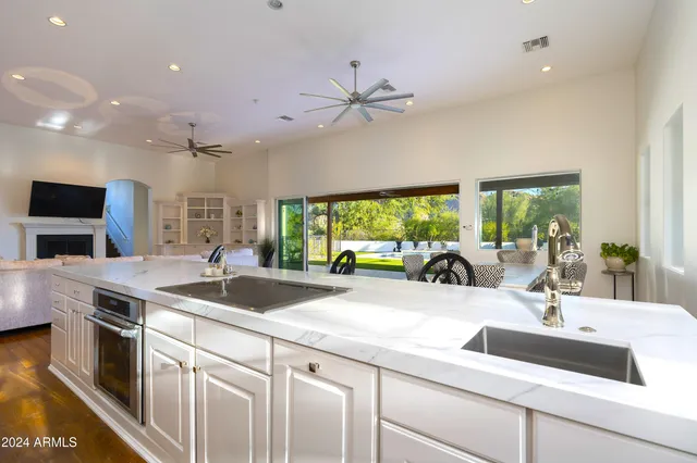 a spacious bedroom with a bed and a window