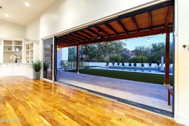 a kitchen with granite countertop a sink a stove and cabinets