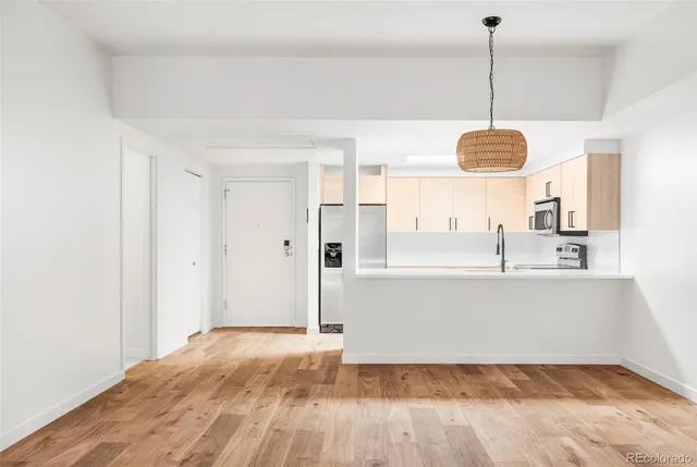 a view of a kitchen with a sink dishwasher a refrigerator and microwave