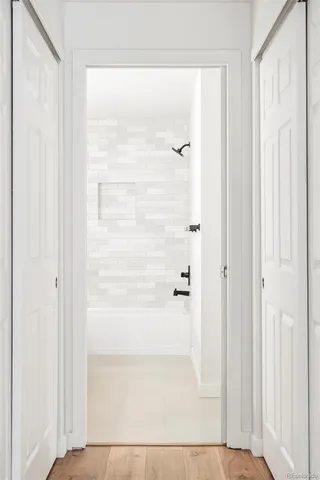 a view of a bathroom with a glass shower door
