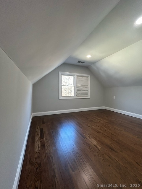 755 Old Town Road Bridgeport, CT 06606 - Photo 12 of 17 an empty room with wooden floor and windows