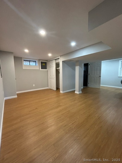 755 Old Town Road Bridgeport, CT 06606 - Photo 14 of 17 a view of an empty room with wooden floor