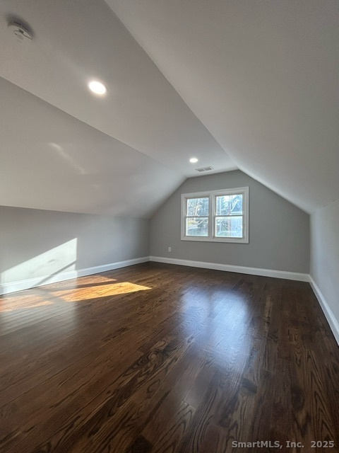 755 Old Town Road Bridgeport, CT 06606 - Photo 10 of 17 a view of empty room with wooden floor and fan