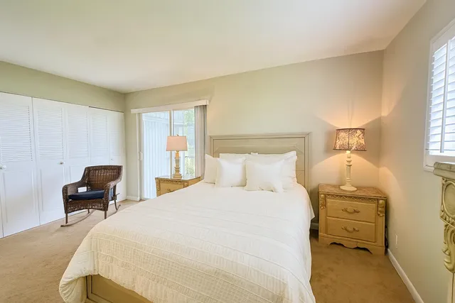 a bedroom with a bed and a windows