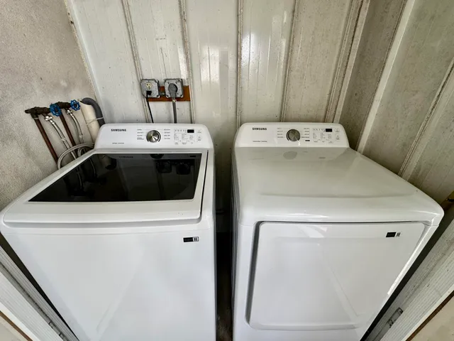 a utility room with dryer and washer