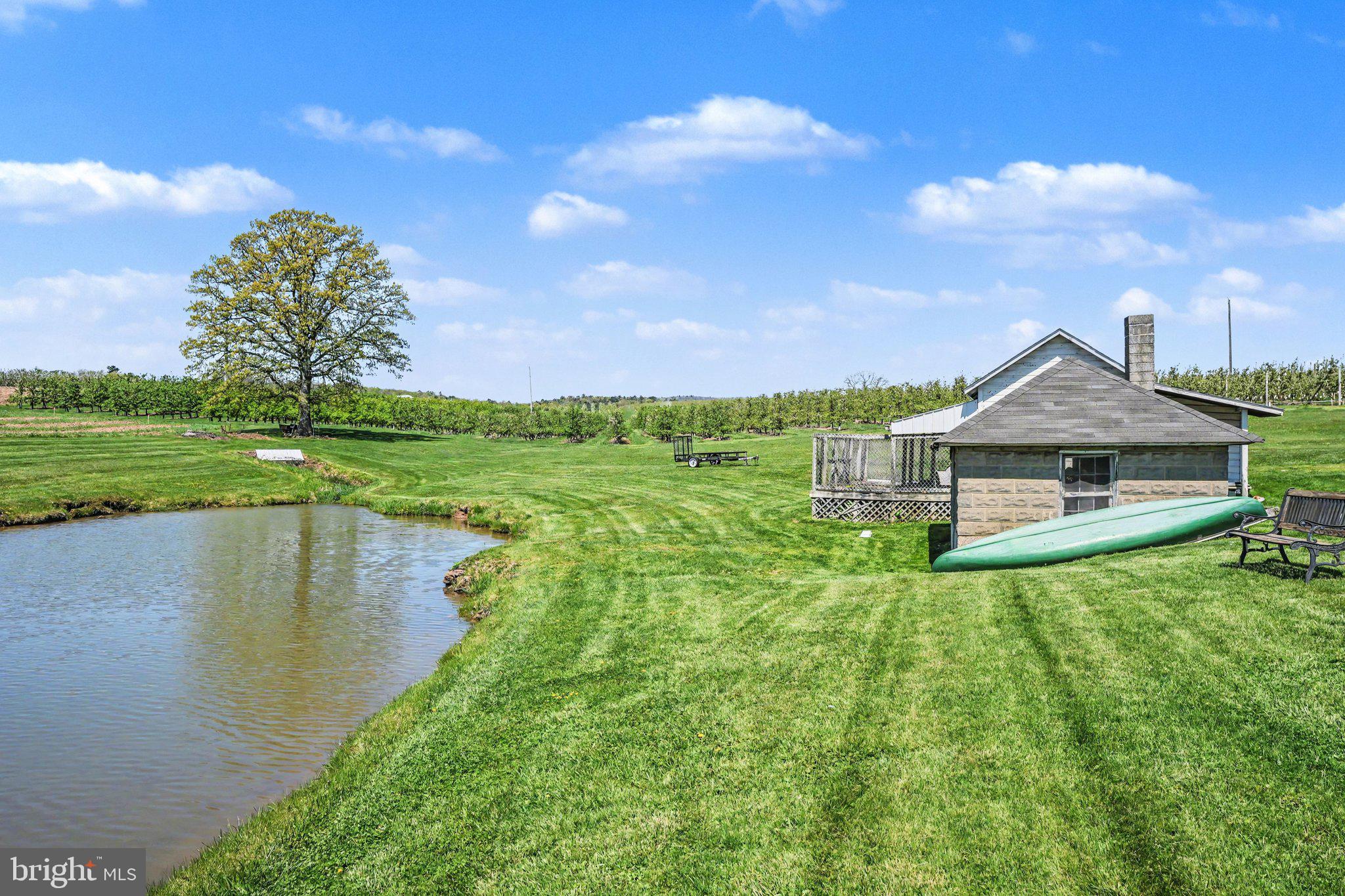 420 Carlisle Road Biglerville, PA 17307 - Photo 32 of 41 a view of a house with a yard and a fountain