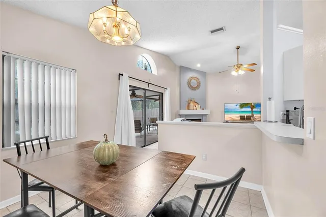 a living room with a table and chairs