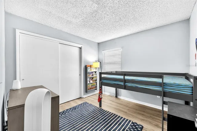 a view of entryway with wooden floor and stairs