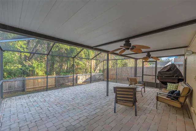 a sitting area with furniture and wooden deck