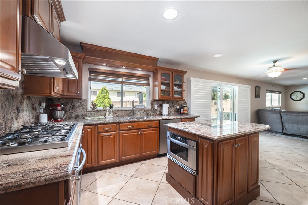 2203 Homewood Avenue Simi Valley, CA 93063 - Photo 8 of 37 a kitchen with stainless steel appliances granite countertop stove a sink and a refrigerator