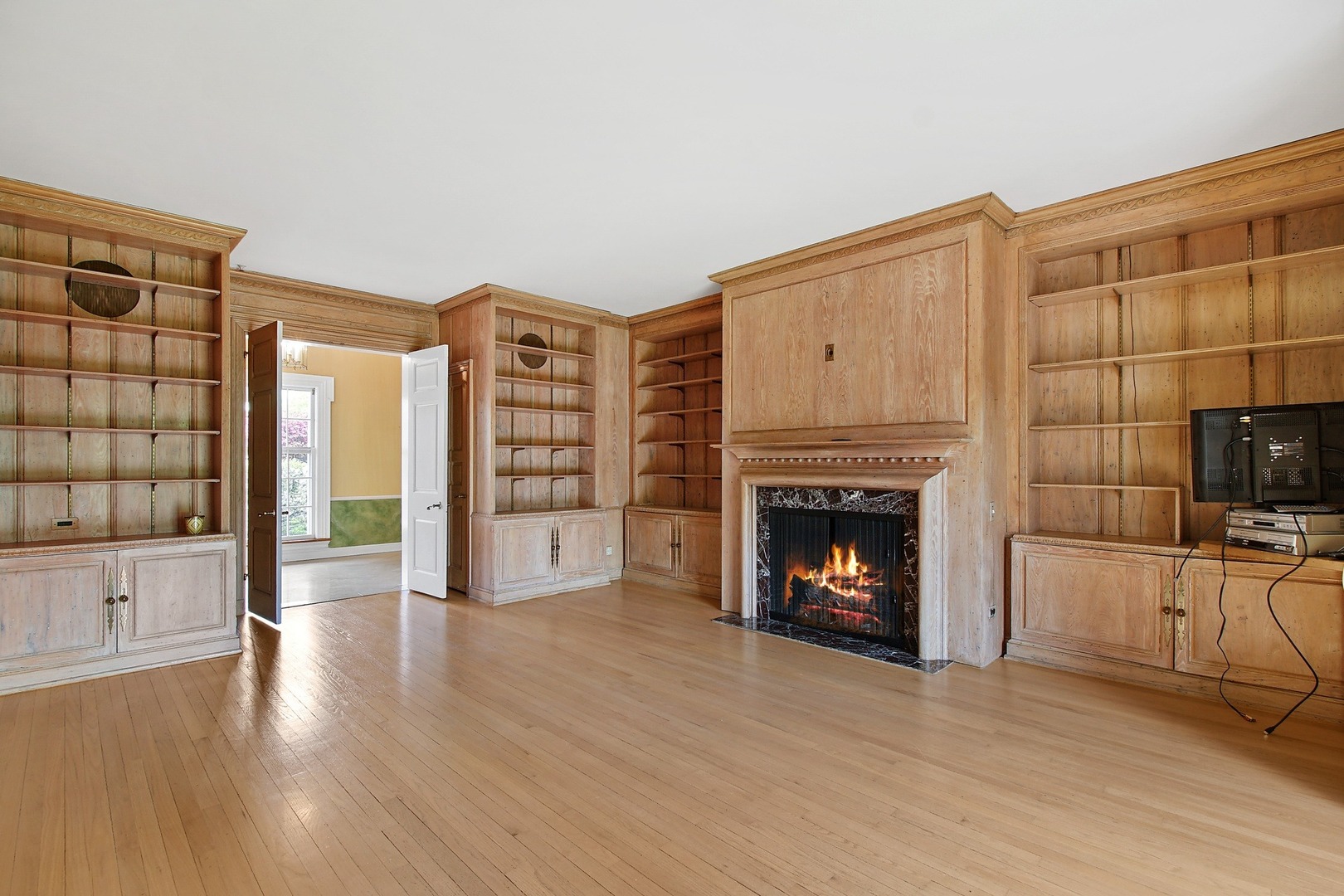 3 Longmeadow Road Winnetka, IL 60093 - Photo 14 of 32 a view of a livingroom with a fireplace and window
