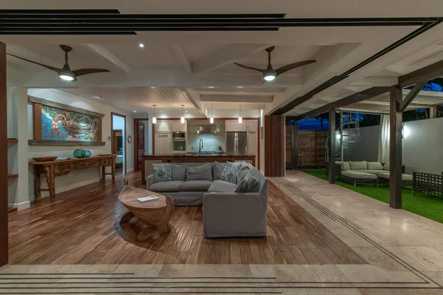 a bathroom with a granite countertop sink and a refrigerator