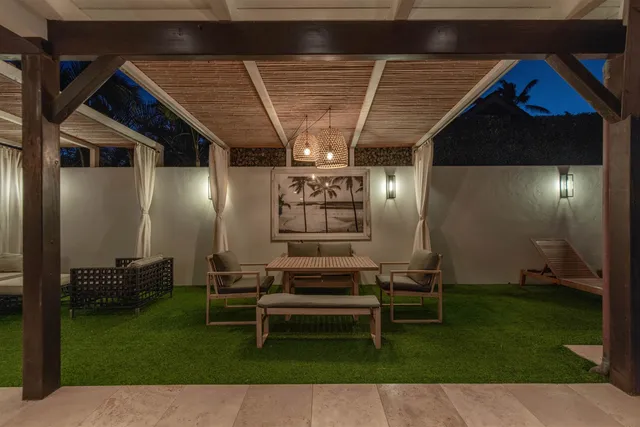 a view of a house with a backyard