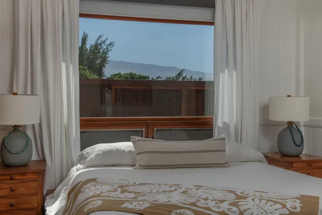 a bathroom with a double vanity sink and a large mirror