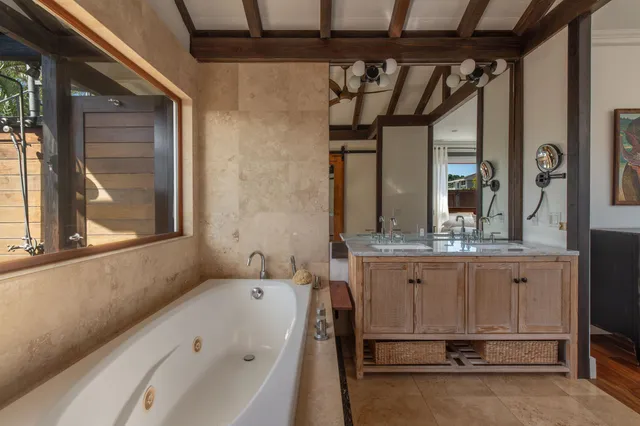 a bathroom with a bathtub and a shower