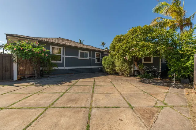 a house with trees in front of it