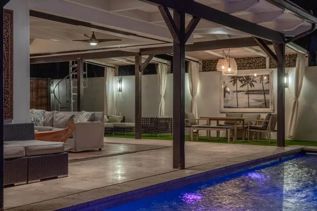 a view of swimming pool with seating space