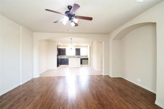 a view of an empty room with a chandelier