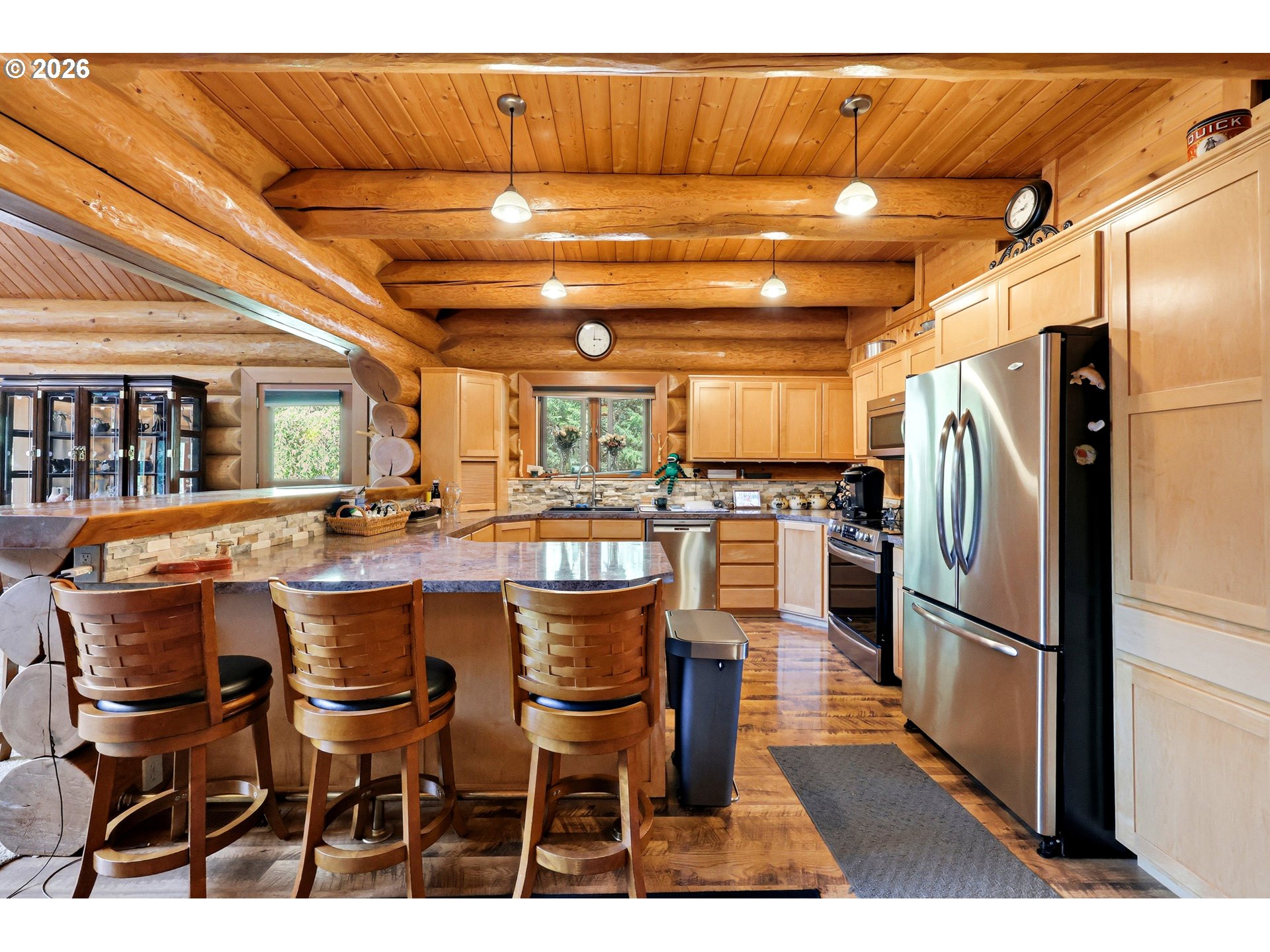 390 Spruce Creek Road Longview, WA 98632 - Photo 19 of 45 a kitchen with a sink and refrigerator