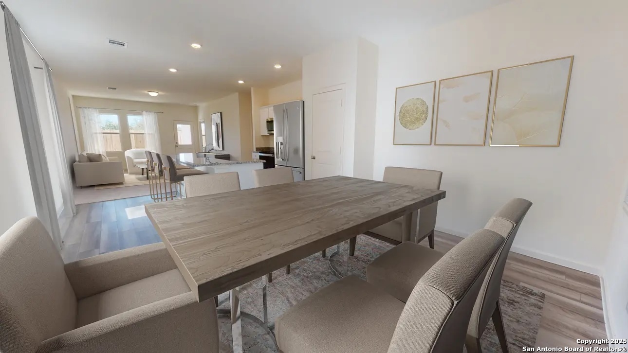 10506 Lesser Snow Adkins, TX 78101 - Photo 4 of 9 a view of a dining room with furniture