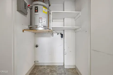 a view of storage and utility room with a sink