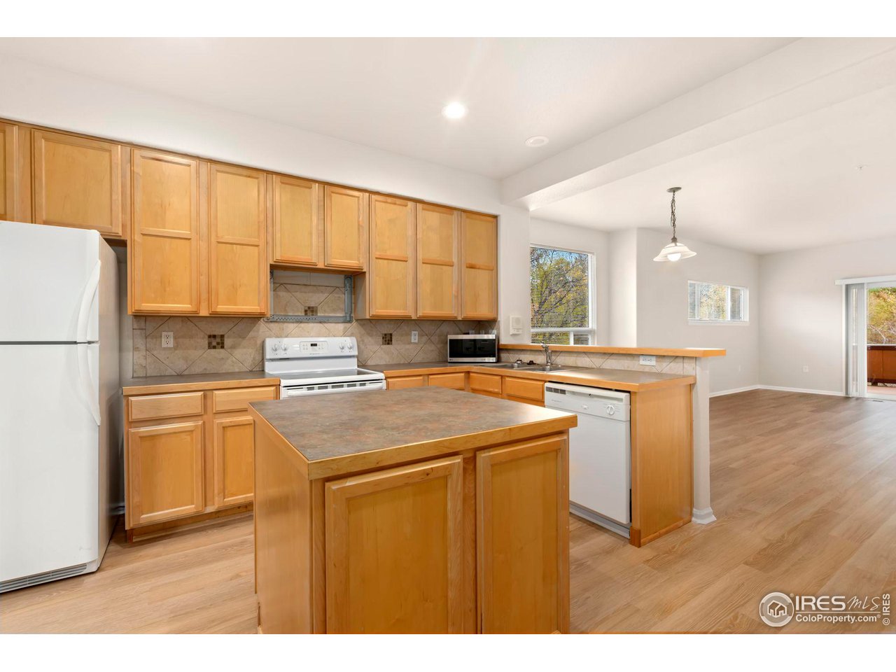 1221 East Prospect Road, Unit 5 Fort Collins, CO 80525 - Photo 13 of 38 Kitchen w/Island, Refrigerator and Dishwasher