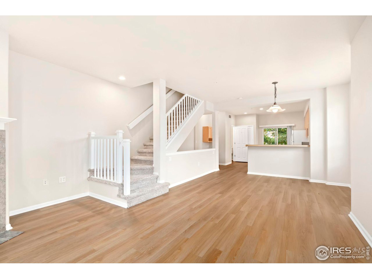 1221 East Prospect Road, Unit 5 Fort Collins, CO 80525 - Photo 6 of 38 Living Room w/New Flooring and Interior Paint