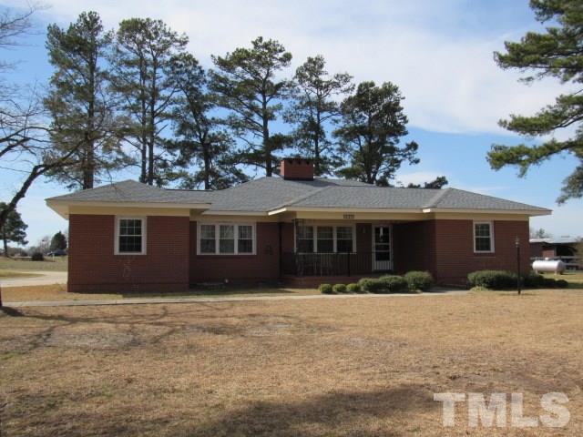 2695 Johnston County Road Angier, NC 27501 - Photo 1 of 25 a front view of house with yard and trees