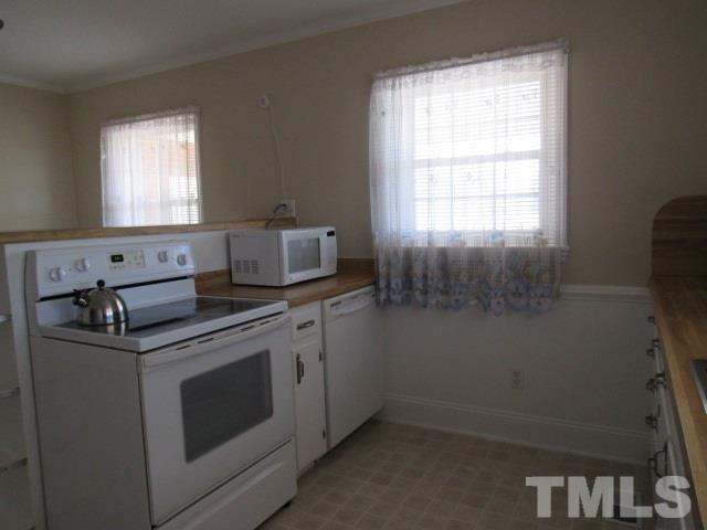 2695 Johnston County Road Angier, NC 27501 - Photo 11 of 25 a view of washer and dryer with window