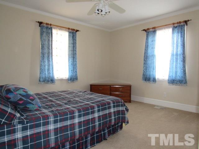 2695 Johnston County Road Angier, NC 27501 - Photo 16 of 25 a bedroom with a bed and a window