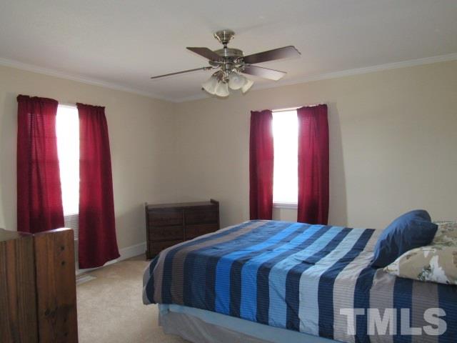 2695 Johnston County Road Angier, NC 27501 - Photo 17 of 25 a bedroom with a bed and window