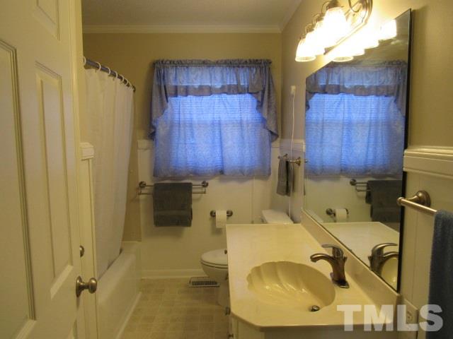 2695 Johnston County Road Angier, NC 27501 - Photo 18 of 25 a bathroom with a sink and mirror