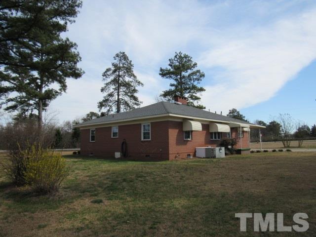 2695 Johnston County Road Angier, NC 27501 - Photo 24 of 25 a view of a house with a yard