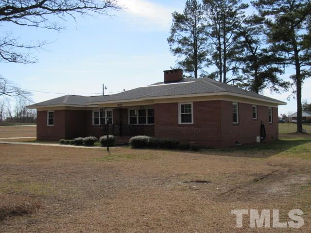 2695 Johnston County Road Angier, NC 27501 - Photo 25 of 25 a front view of a house with a yard