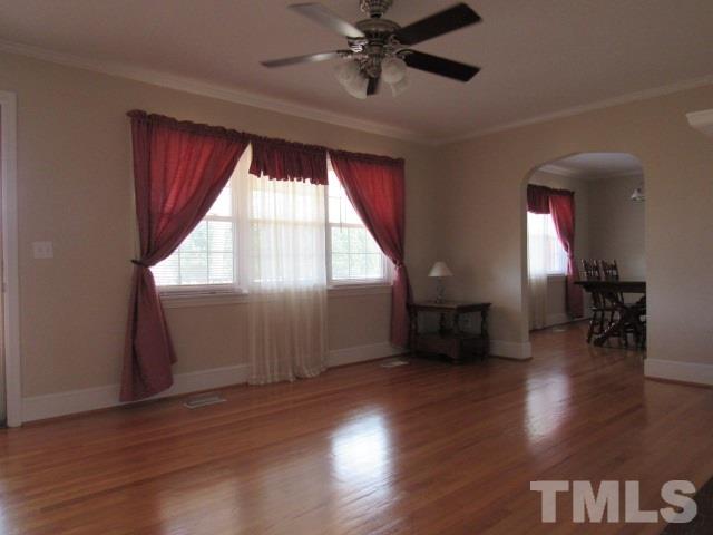 2695 Johnston County Road Angier, NC 27501 - Photo 4 of 25 a view of empty room with wooden floor and fan