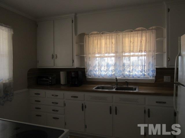 2695 Johnston County Road Angier, NC 27501 - Photo 9 of 25 a bathroom with a sink and a window
