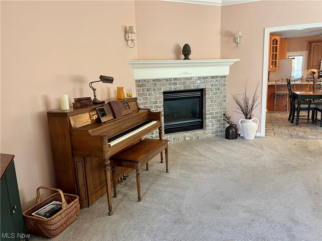 185 B Mathews Road Youngstown, OH 44512 - Photo 19 of 35 Miscellaneous room featuring ornamental molding, a fireplace, and light tile floors