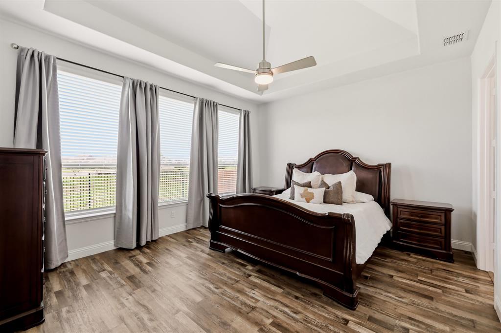 1313 Kirkwood Road Rockwall, TX 75087 - Photo 21 of 39 Huge primary suite with backyard views.