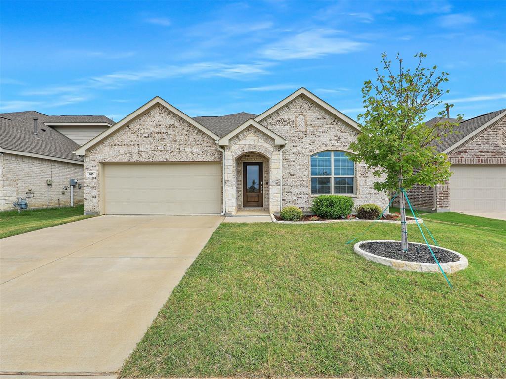 910 Torrey Avenue Princeton, TX 75407 - Photo 1 of 39 a front view of a house with a yard
