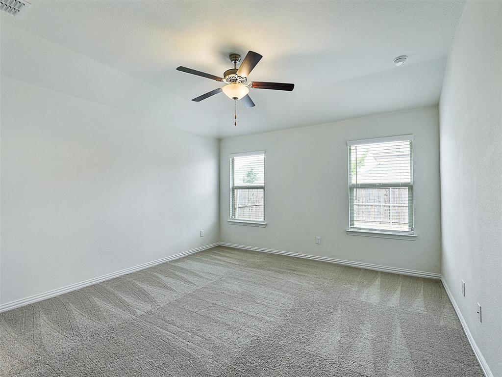 910 Torrey Avenue Princeton, TX 75407 - Photo 18 of 39 a view of an empty room with a window