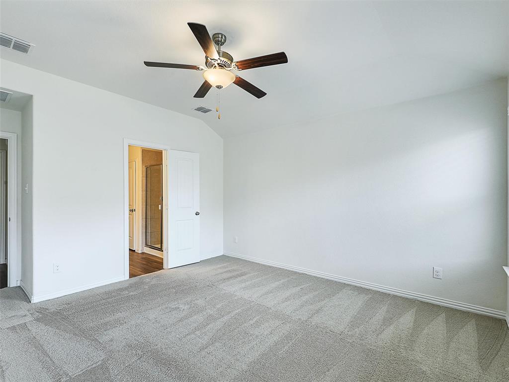 910 Torrey Avenue Princeton, TX 75407 - Photo 19 of 39 a view of an empty room with wooden floor