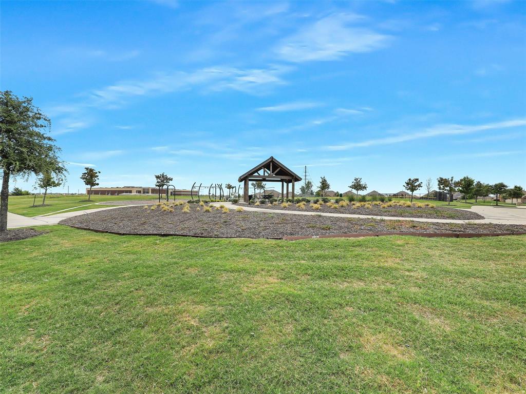 910 Torrey Avenue Princeton, TX 75407 - Photo 2 of 39 a view of a house with a yard and lake view
